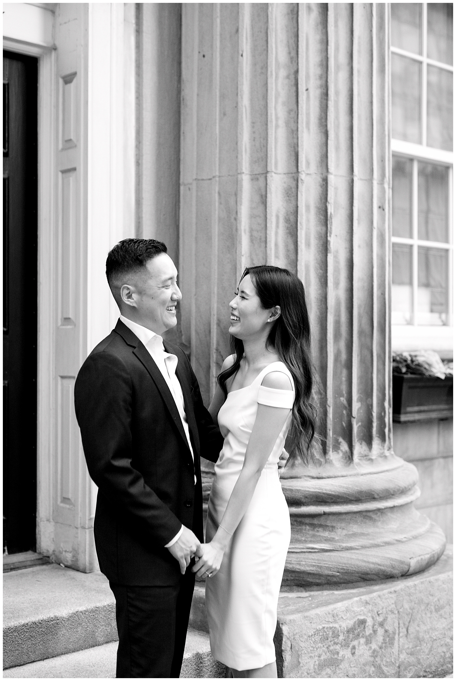 Downtown Toronto Financial District Engagement Session Modern Editorial Timeless Couple Candid Laughter Moment in Front of Beautiful Door | Toronto Wedding Photography Jacqueline James Photography