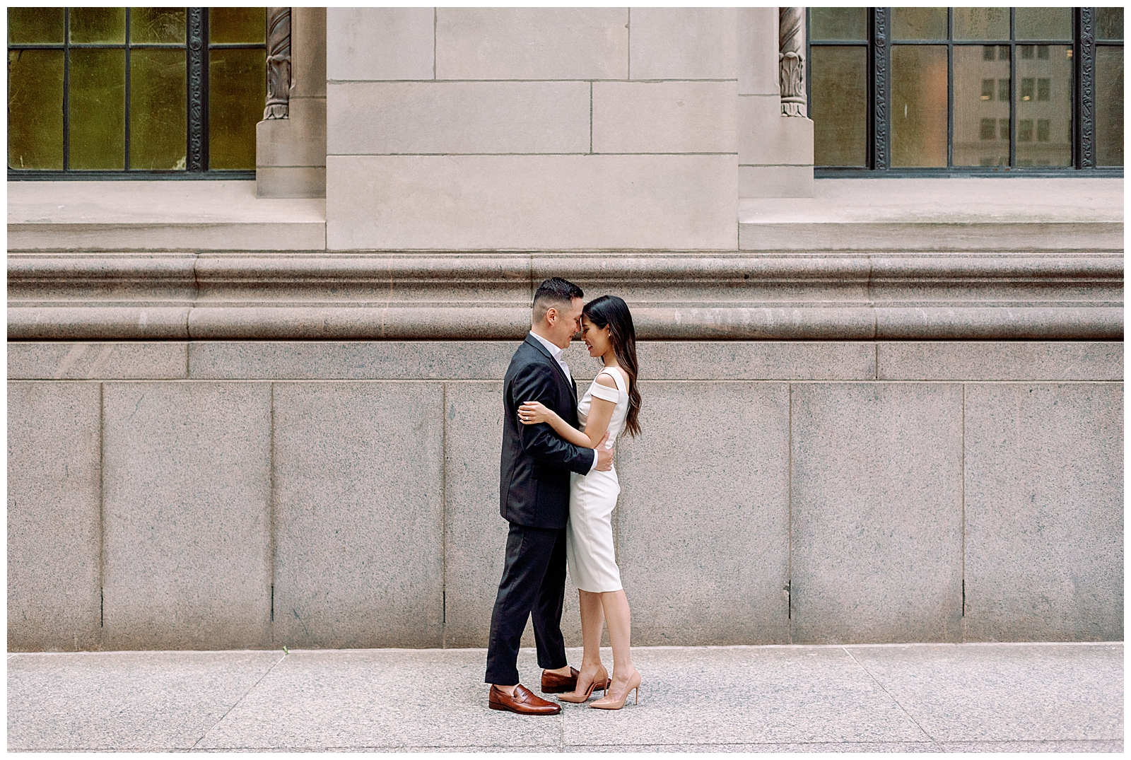 Downtown Toronto Financial District Engagement Session Modern Editorial Timeless Couple Embracing in Front of Beautiful Door | Toronto Wedding Photography Jacqueline James Photography