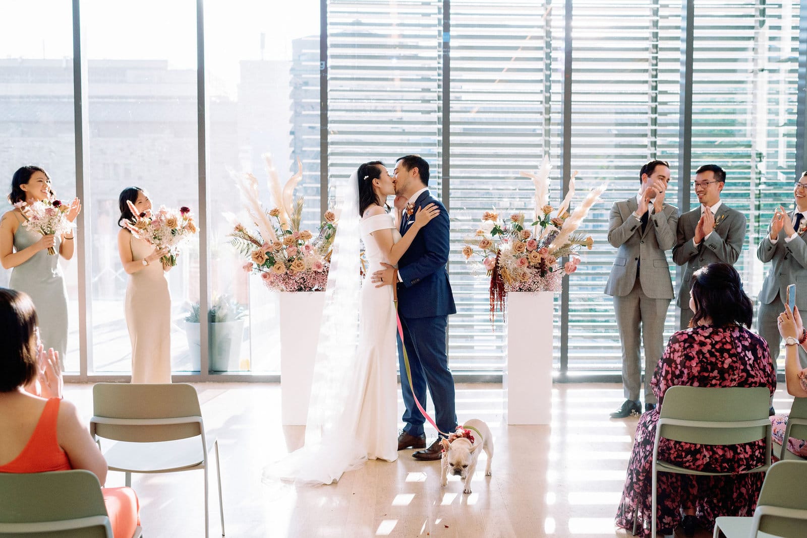 Couples first kiss at modern fall wedding ceremony gardiner museum downtown toronto modern romantic wedding jacqueline james photography