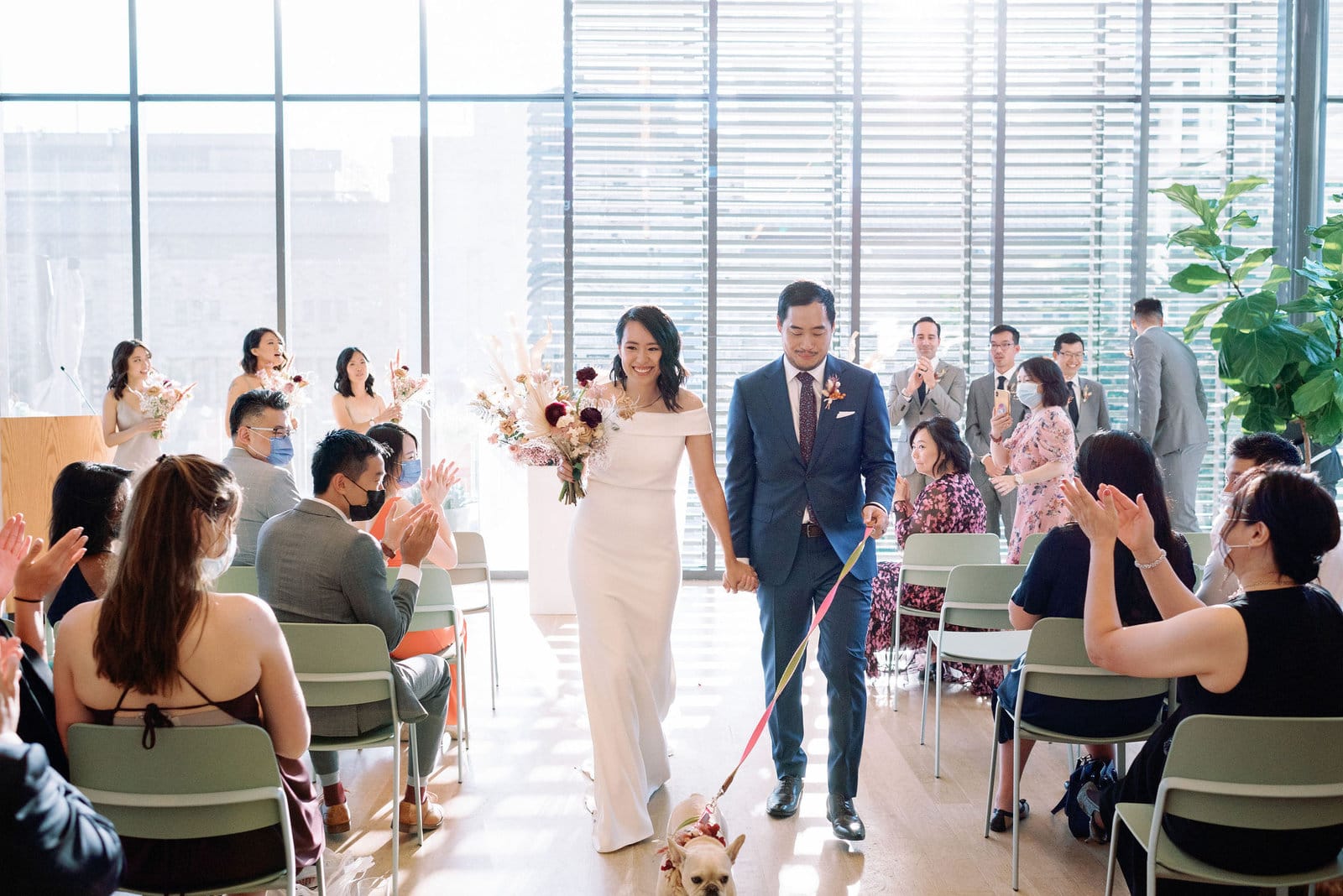 Couples recessional at modern fall wedding ceremony gardiner museum downtown toronto modern romantic wedding jacqueline james photography
