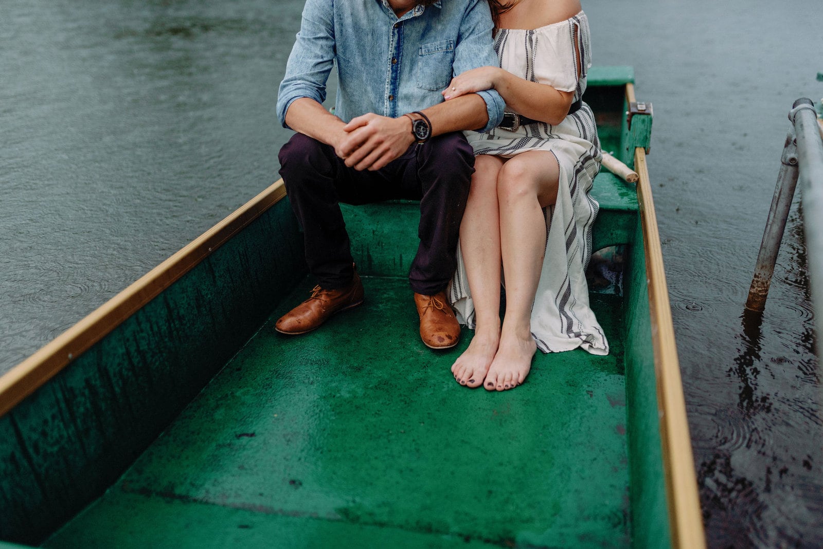 couple romantic embrace stormy engagement photos toronto jacqueline james photography rowboats the notebook storm clouds