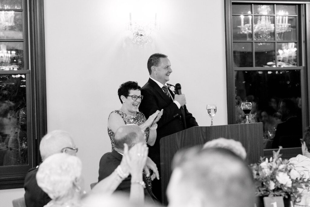 Candid reception guests laughing at pipers heath wedding toronto wedding venue jacqueline james photography