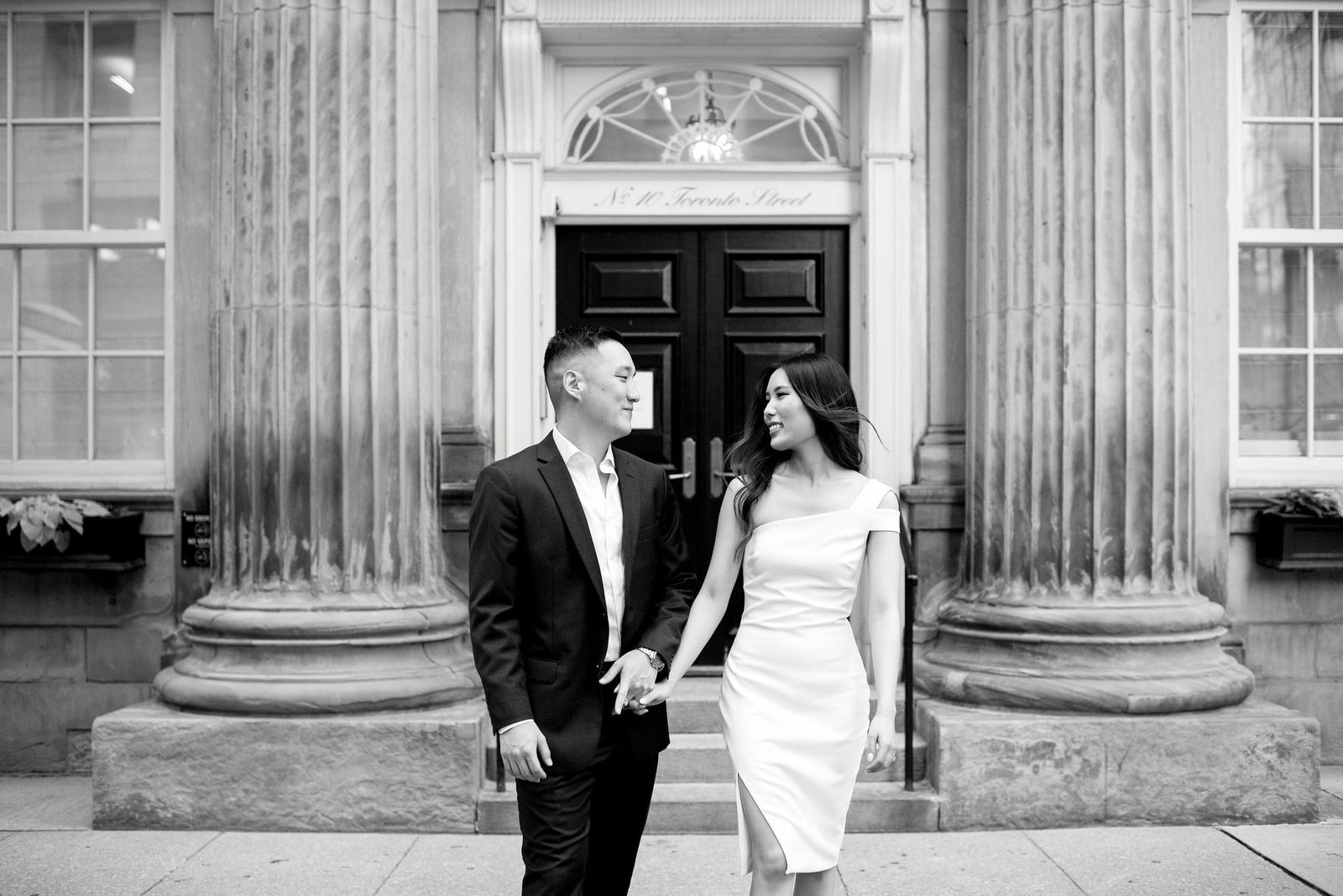 Downtown Toronto Engagement Photos Financial District Modern Editorial Timeless Couple Embracing in Front of Beautiful Door | Toronto Wedding Photography Jacqueline James Photography
