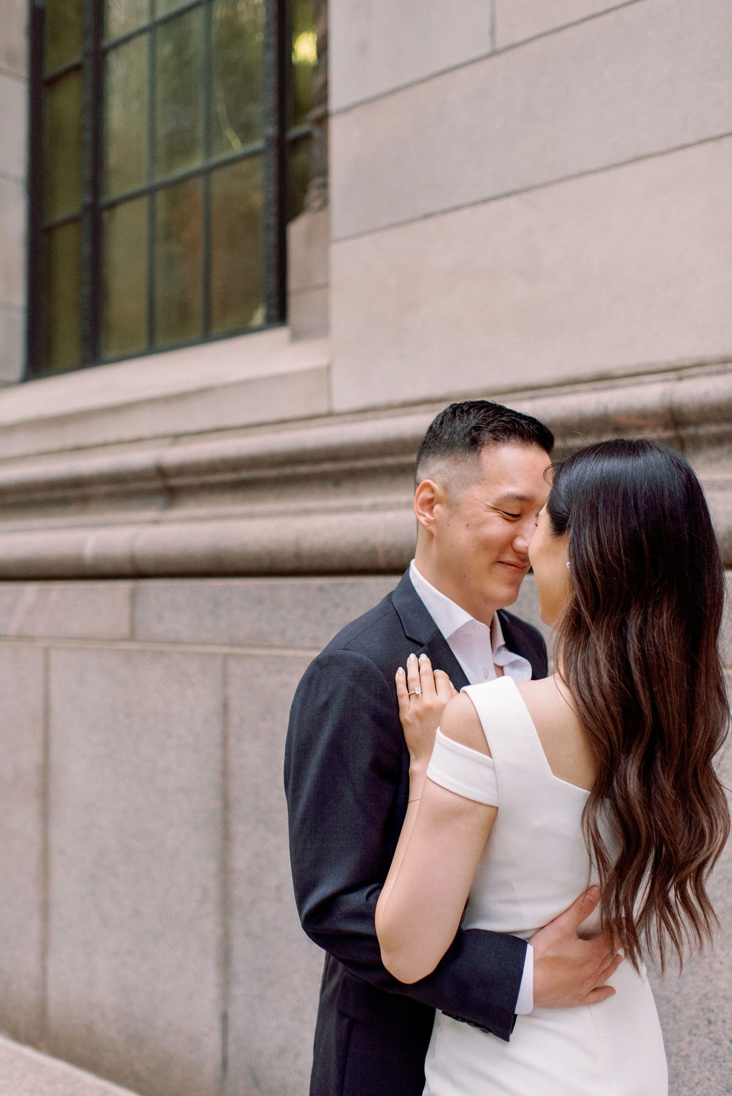 Downtown Toronto Engagement Photos Financial District Modern Editorial Timeless Couple Embracing in Front of Beautiful Door | Toronto Wedding Photography Jacqueline James Photography