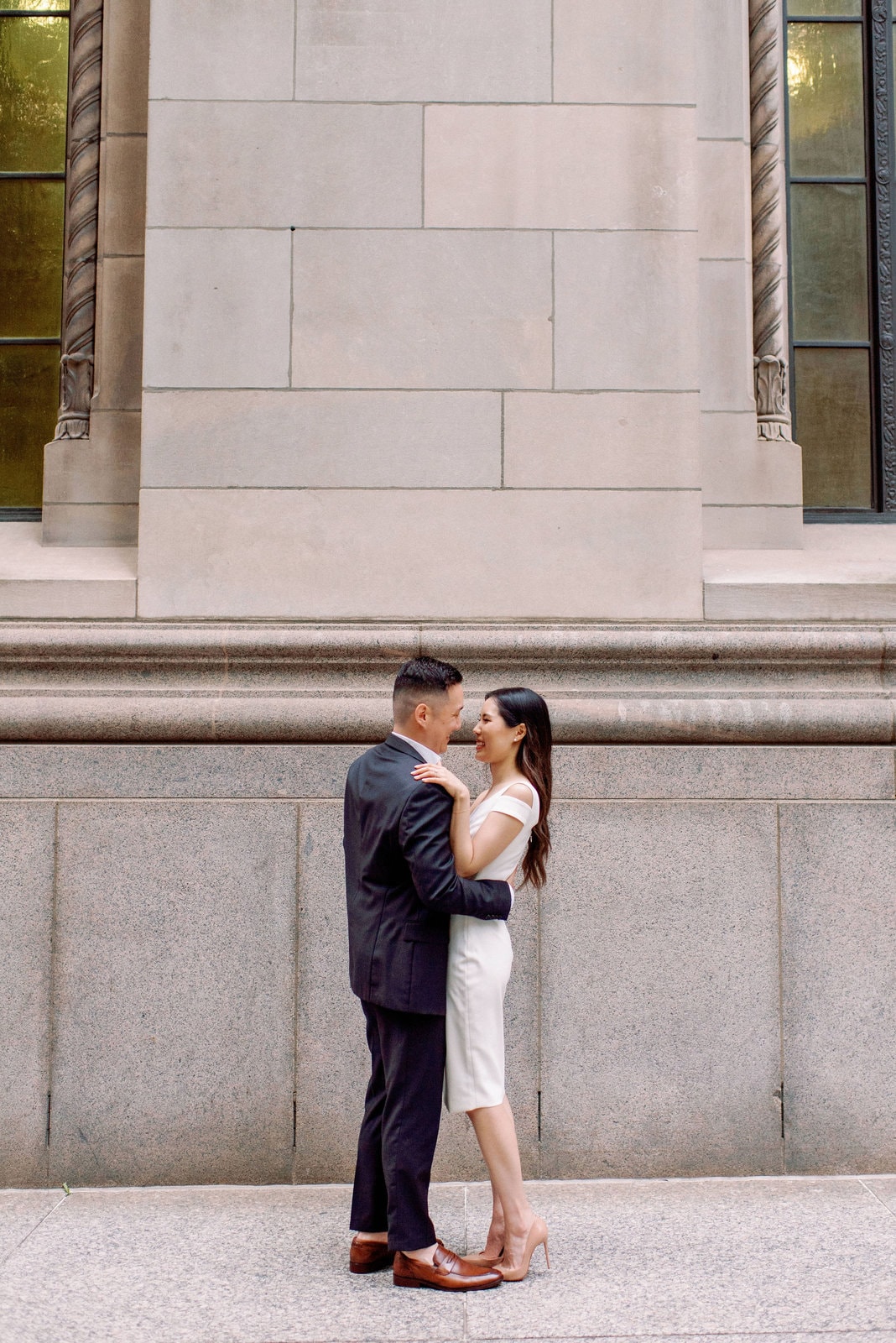 Downtown Toronto Engagement Photos Financial District Modern Editorial Timeless Couple Embracing in Front of Beautiful Door | Toronto Wedding Photography Jacqueline James Photography