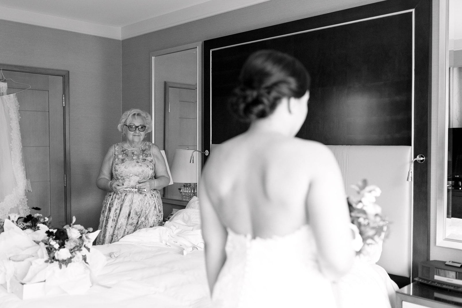 mother watches lovingly at bride getting ready morning of wedding day featured by martha stewart weddings steam whistle wedding toronto wedding venue jacqueline james photography