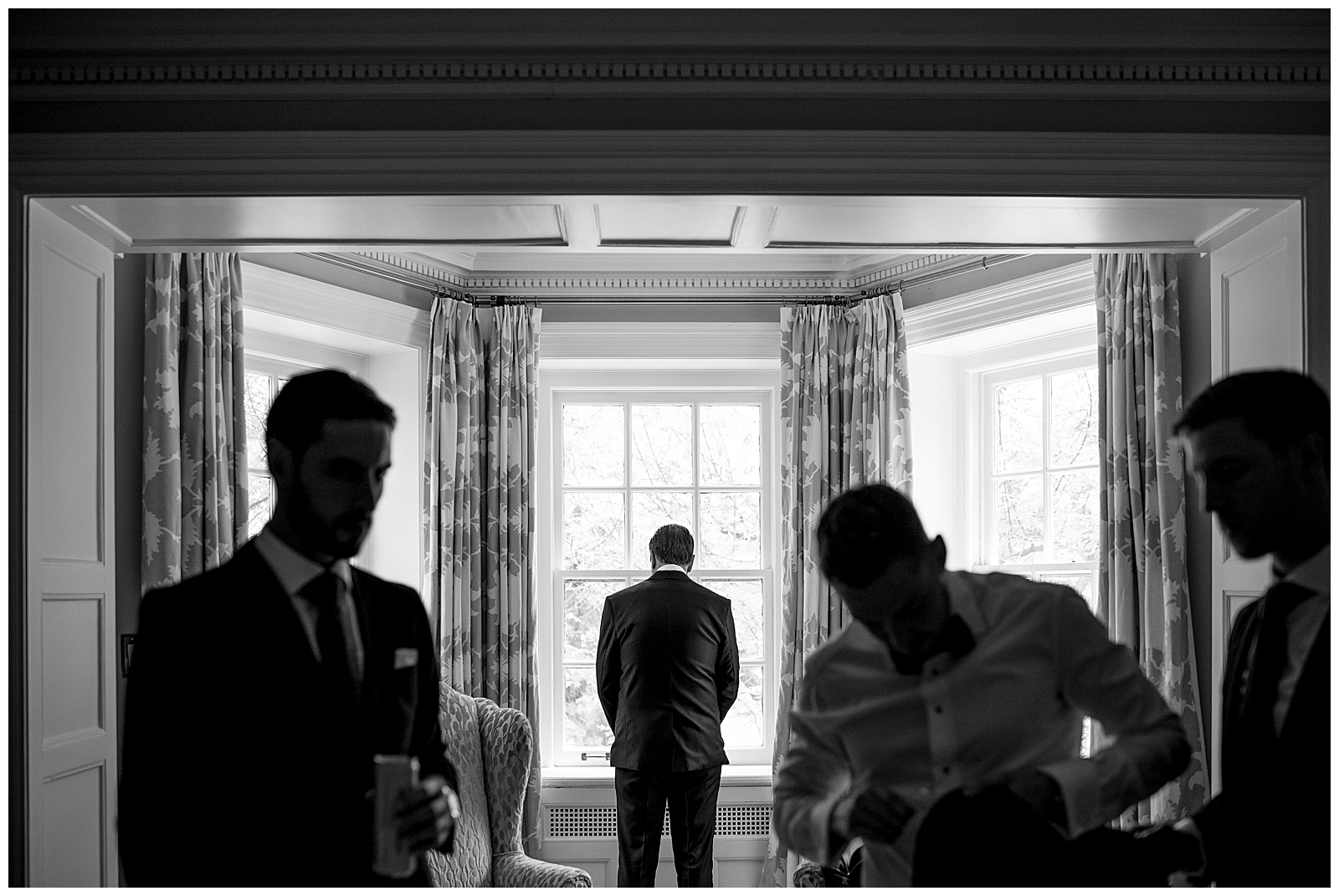 Photojournalistic photo of father waiting morning of wedding day anxious excited excitement emotional