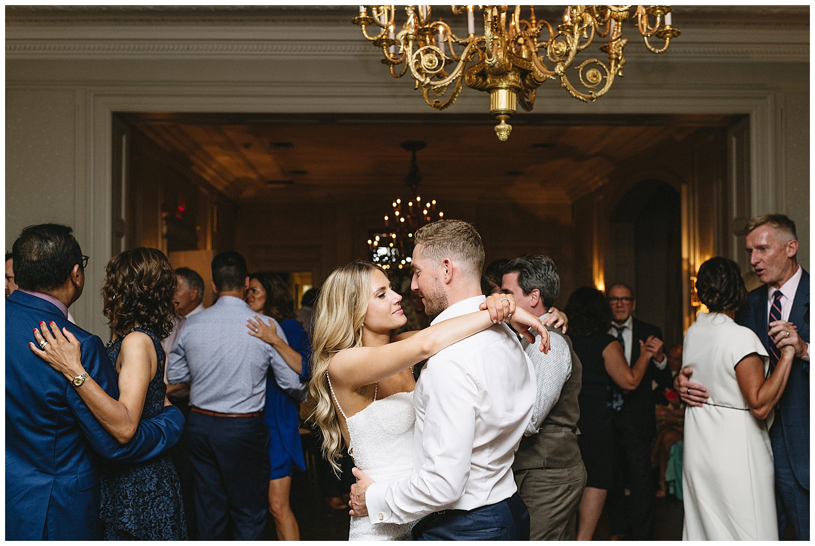 Reception Dancing Party Elated Bride and Groom Romantic Embrace 