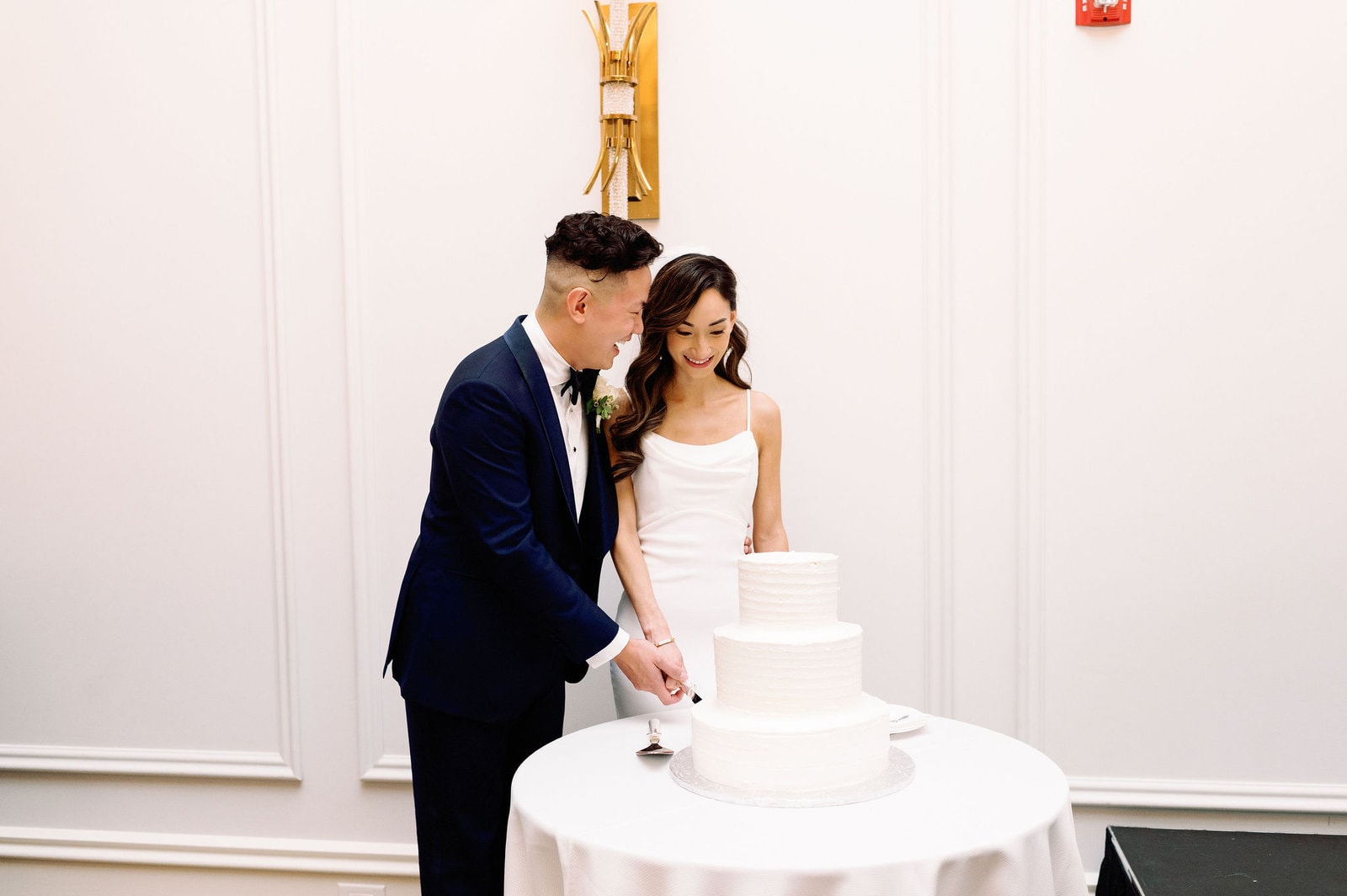 Couple Cuts Wedding Cake at Wedding Reception at Arlington Estate Wedding Venue, Modern Romantic Summer Intimate Elopement Jacqueline James Photography