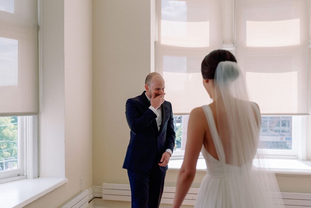 emotional groom tearful happy sees bride at first look at Gladstone House Wedding Toronto Wedding Venue Jacqueline James Photography
