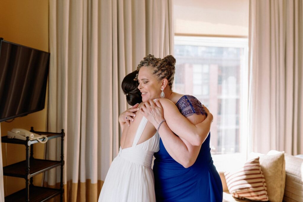 emotional mother embraces bride on wedding day tears happy at Gladstone House Wedding Toronto Wedding Venue Jacqueline James Photography