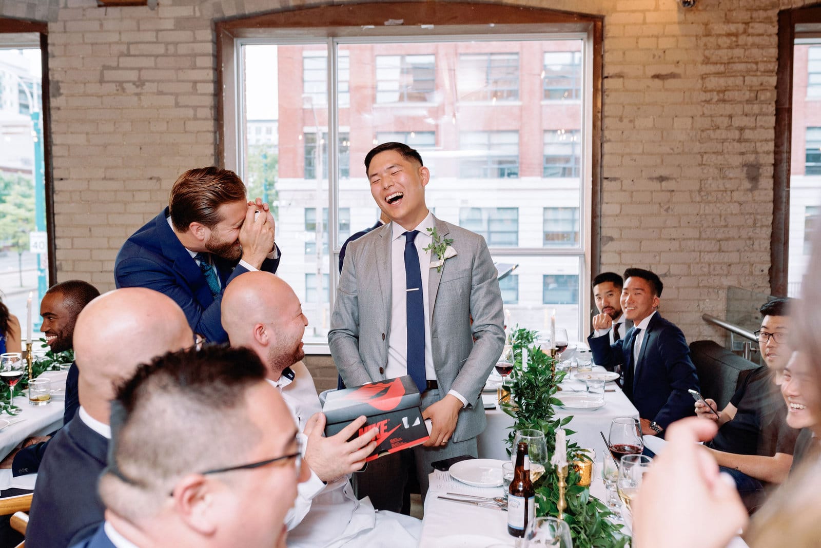 Groom Gets Iced Smirnoff During Reception at Hotel Ocho Downtown Toronto Wedding Photographer Jacqueline James Photography