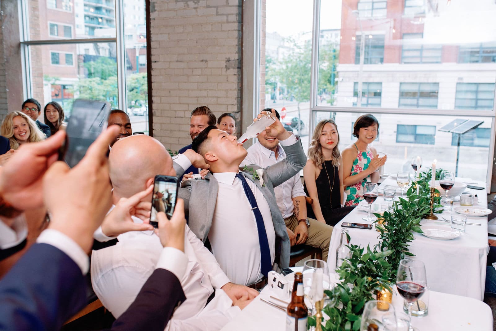 Groom Gets Iced Smirnoff During Reception at Hotel Ocho Downtown Toronto Wedding Photographer Jacqueline James Photography