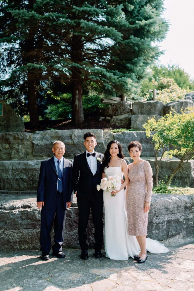 family photos by waterfall at whistle bear golf club wedding cambridge