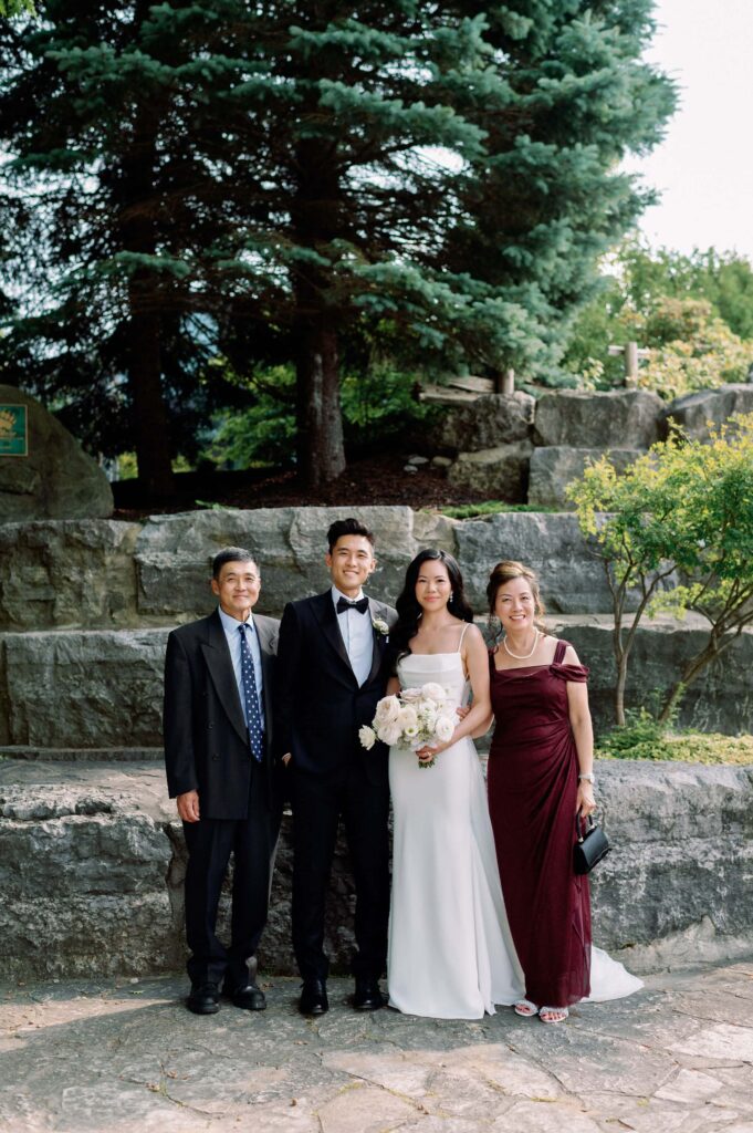 family photos by waterfall at whistle bear golf club wedding cambridge