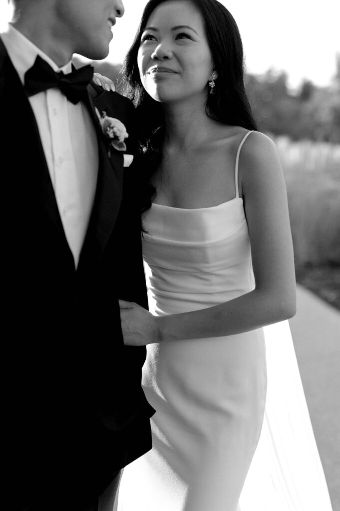 modern editorial timeless wedding portrait at sunset golden hour bride and groom walking at whistle bear golf club wedding cambridge