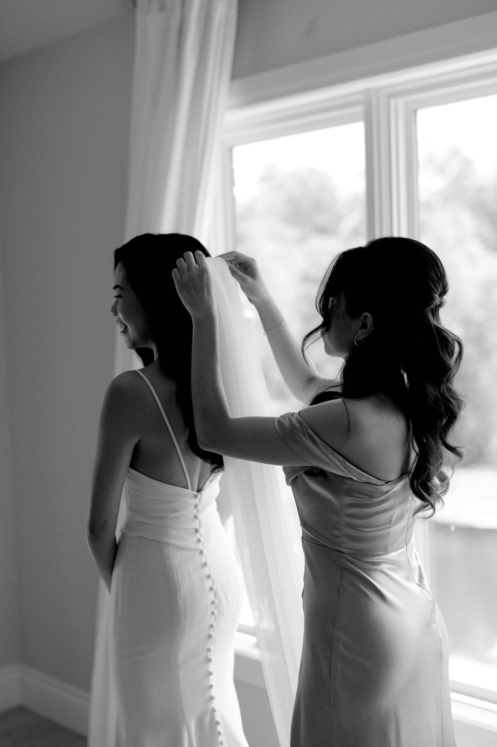 bride getting ready looking at wedding dress morning happy smiles laughter whistle bear golf club wedding