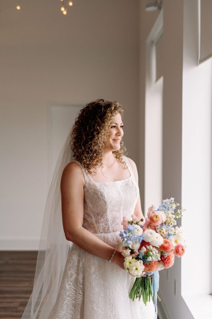 editorial candid moment of bride in wedding dress bridal portrait classic hotel x toronto