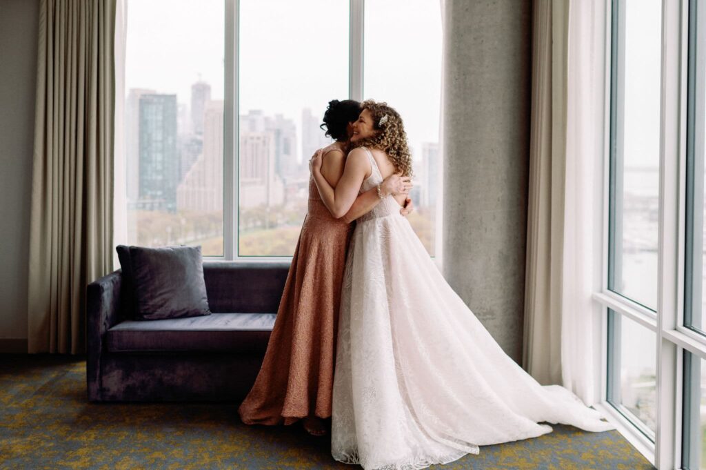 bride getting into wedding dress with mom at hotel x toronto 