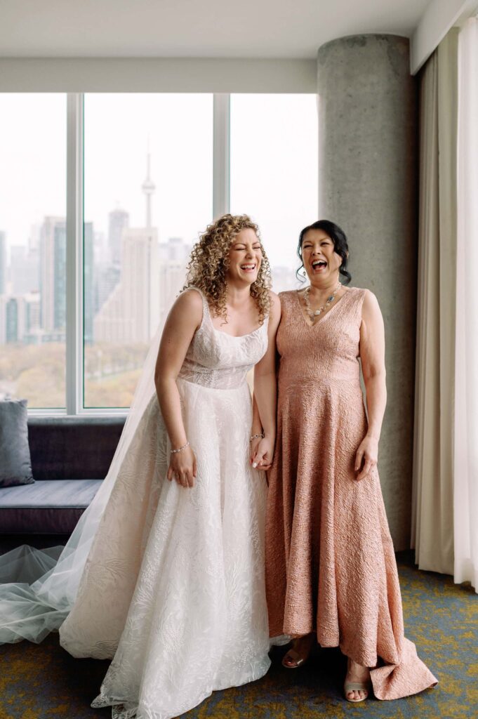 candid moment bride with her parents laughing emotional at hotel x toronto wedding