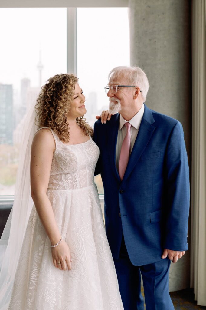 candid moment bride with her parents laughing emotional at hotel x toronto wedding