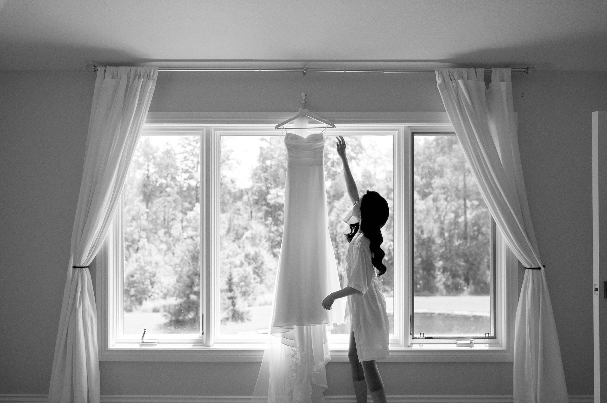 bride getting ready looking at wedding dress morning happy smiles laughter whistle bear golf club wedding