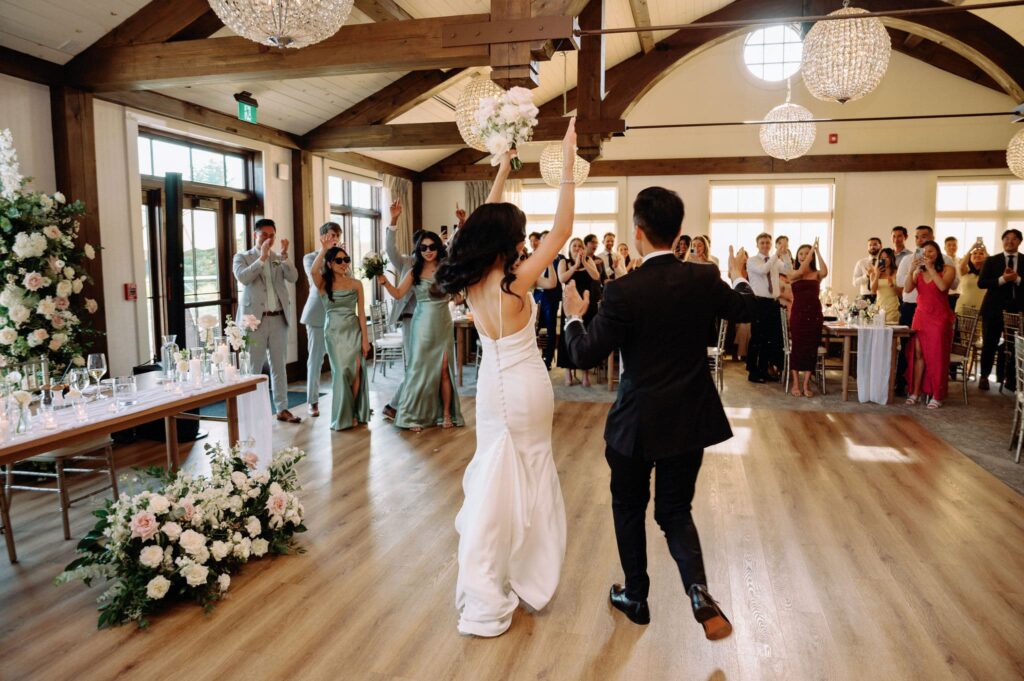 happy candid reception moment at whistle bear golf club wedding cambridge