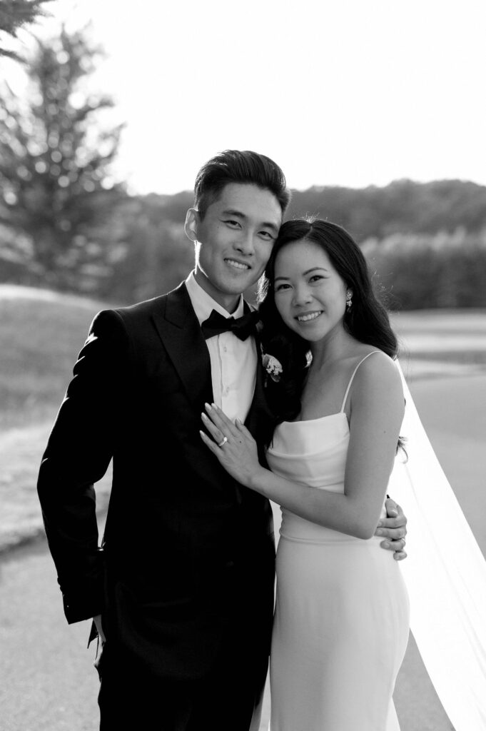 modern editorial timeless wedding portrait at sunset golden hour bride and groom walking at whistle bear golf club wedding cambridge