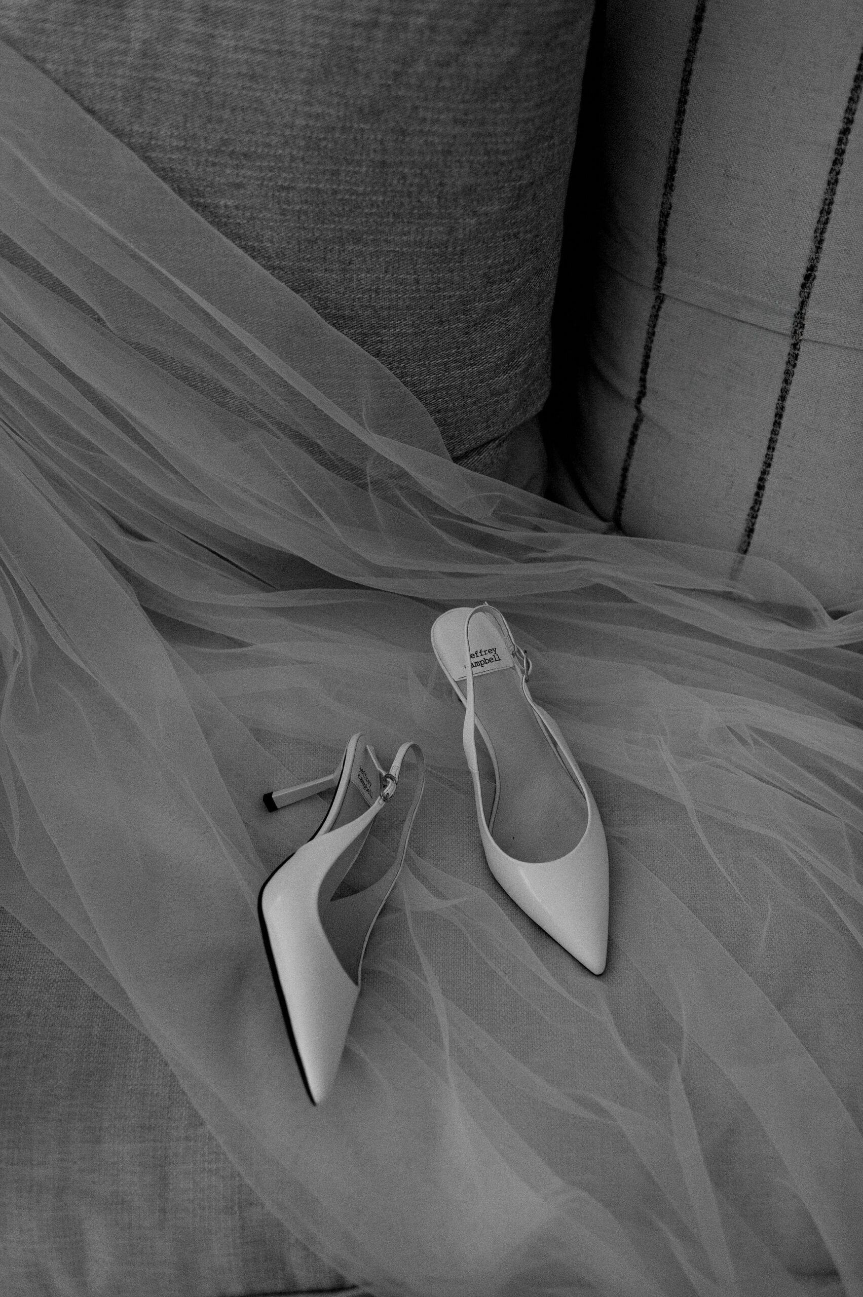 White bridal shoes on soft veil in suite at 1 Hotel Toronto