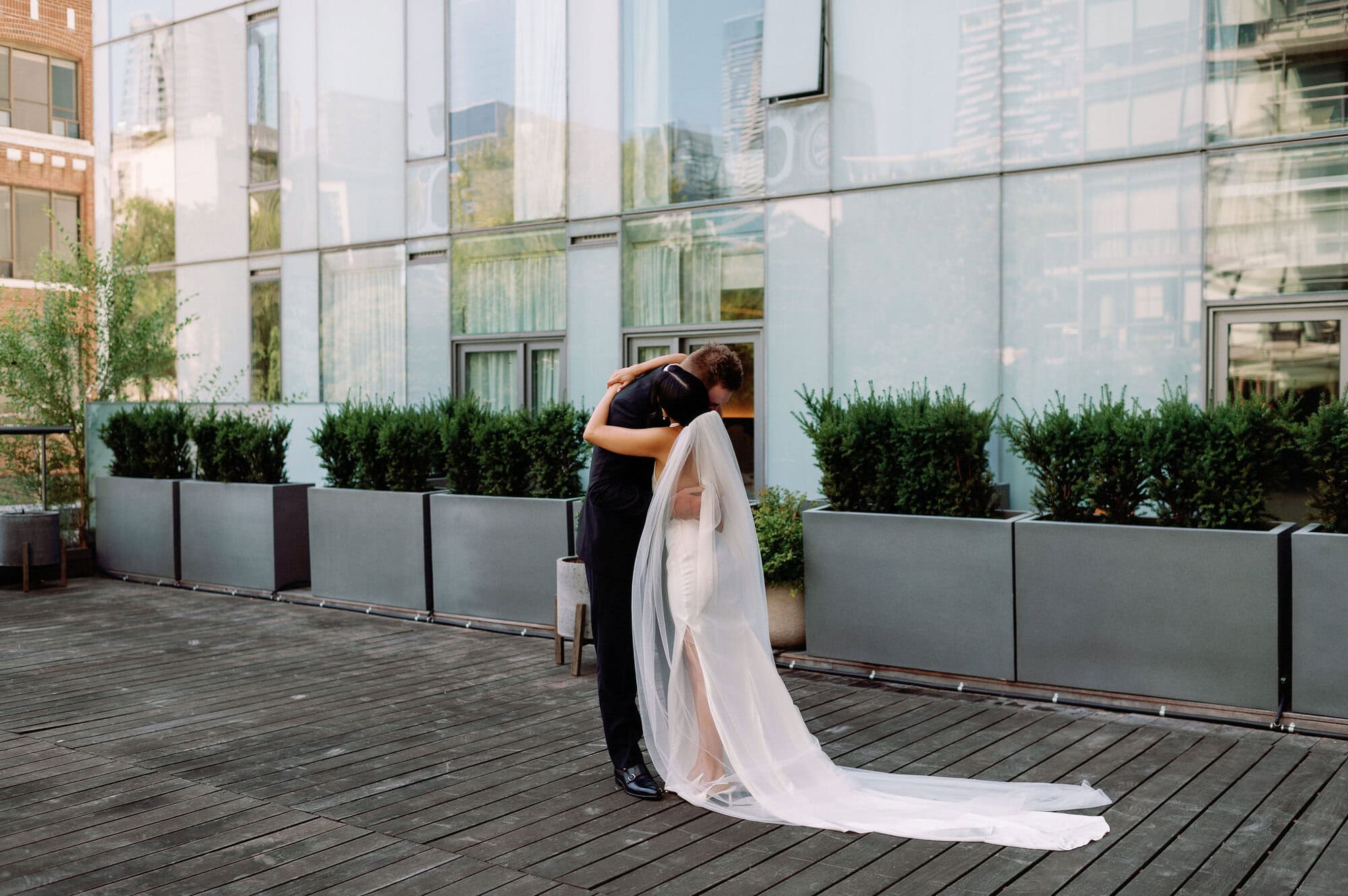 Groom turning to see bride during first look at 1 Hotel Toronto