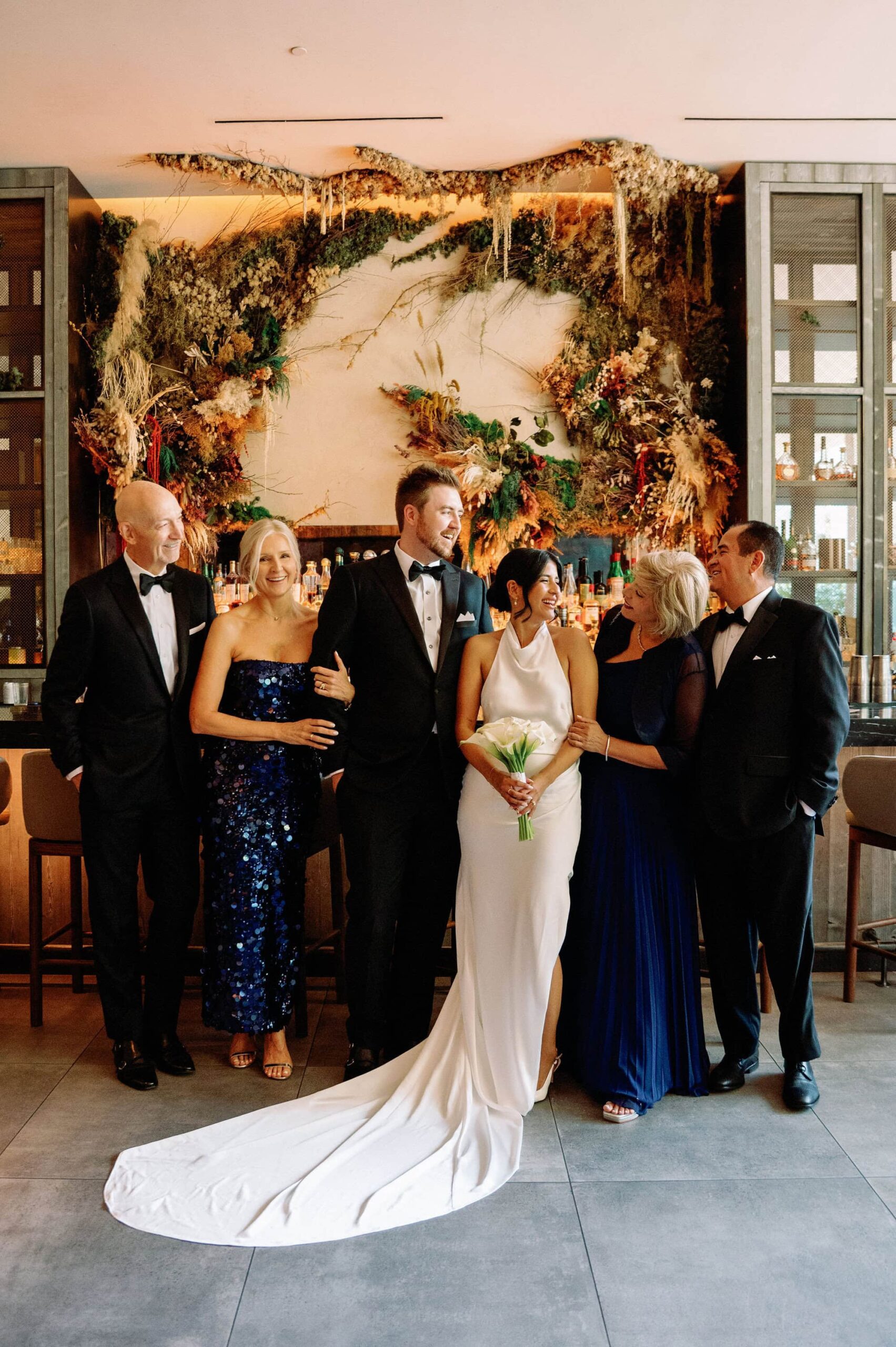 Bride and parents smiling during formal portraits at 1 Hotel Toronto