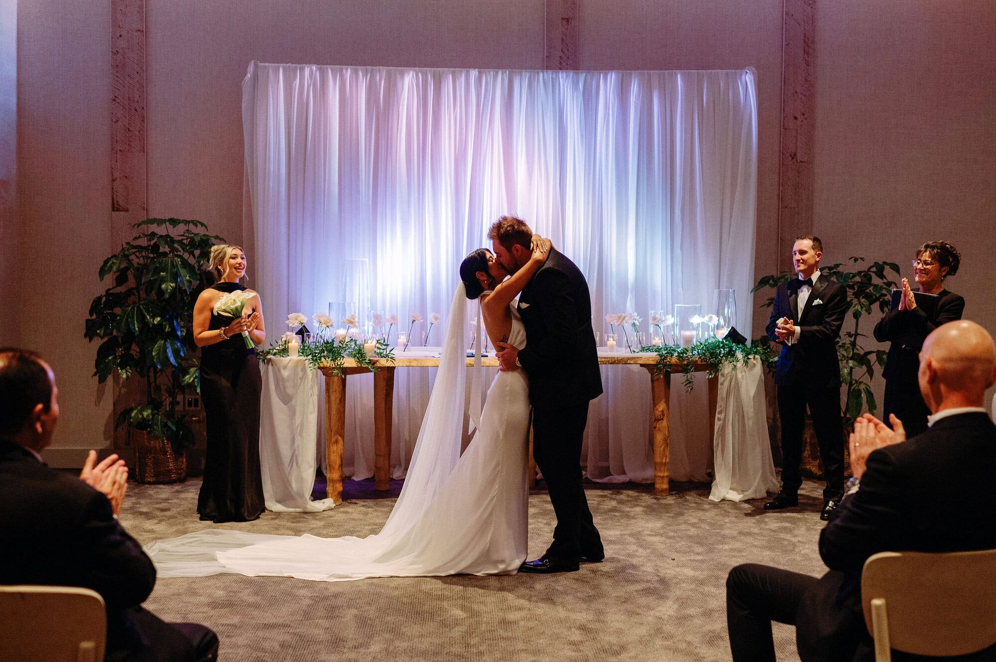 Bride and groom first kiss as newlyweds at 1 Hotel Toronto ceremony