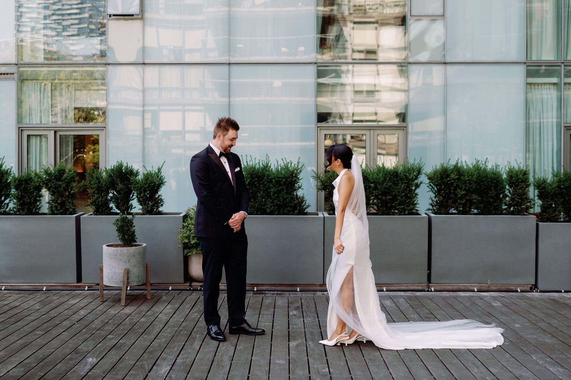 Groom turning to see bride during first look at 1 Hotel Toronto