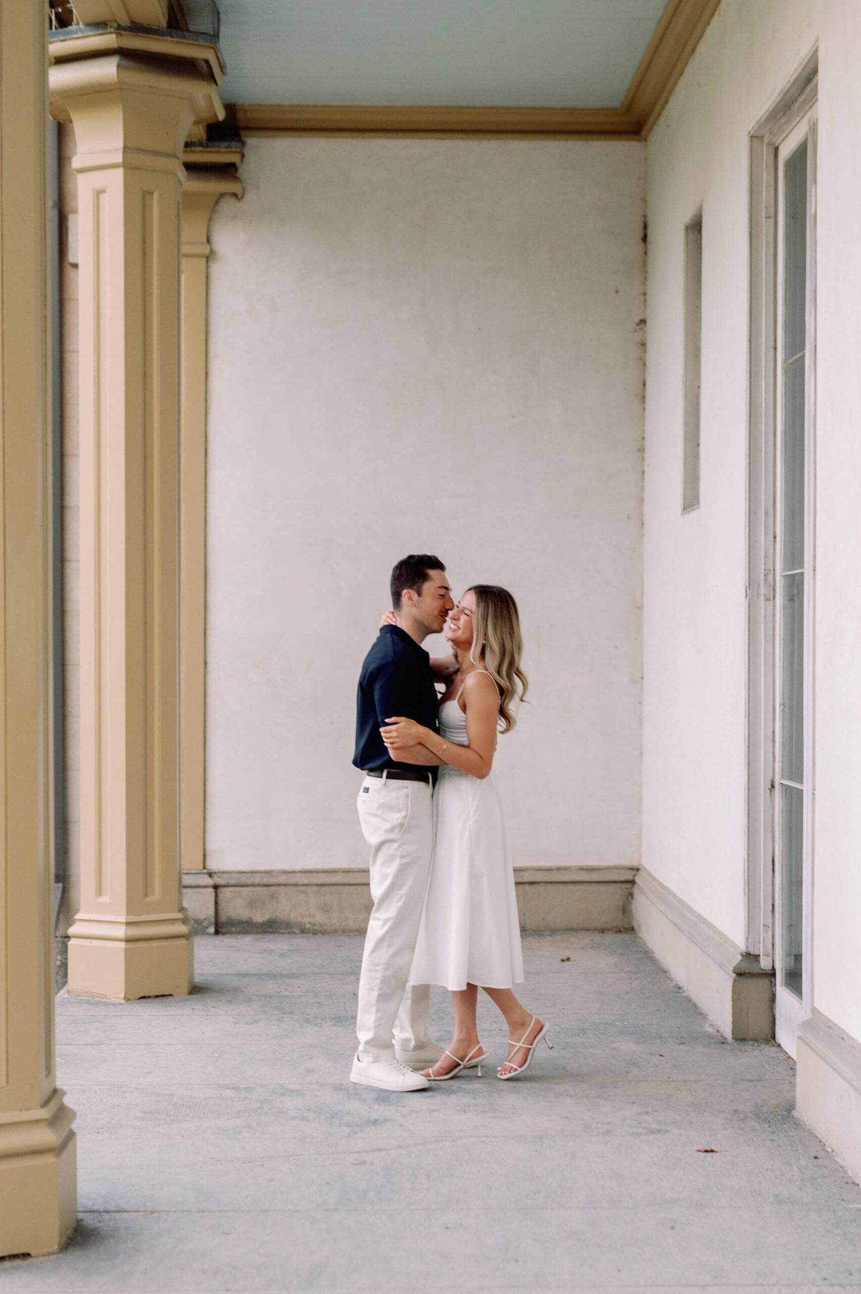 Candid laugh under the portico columns at Dundurn Castle in Hamilton