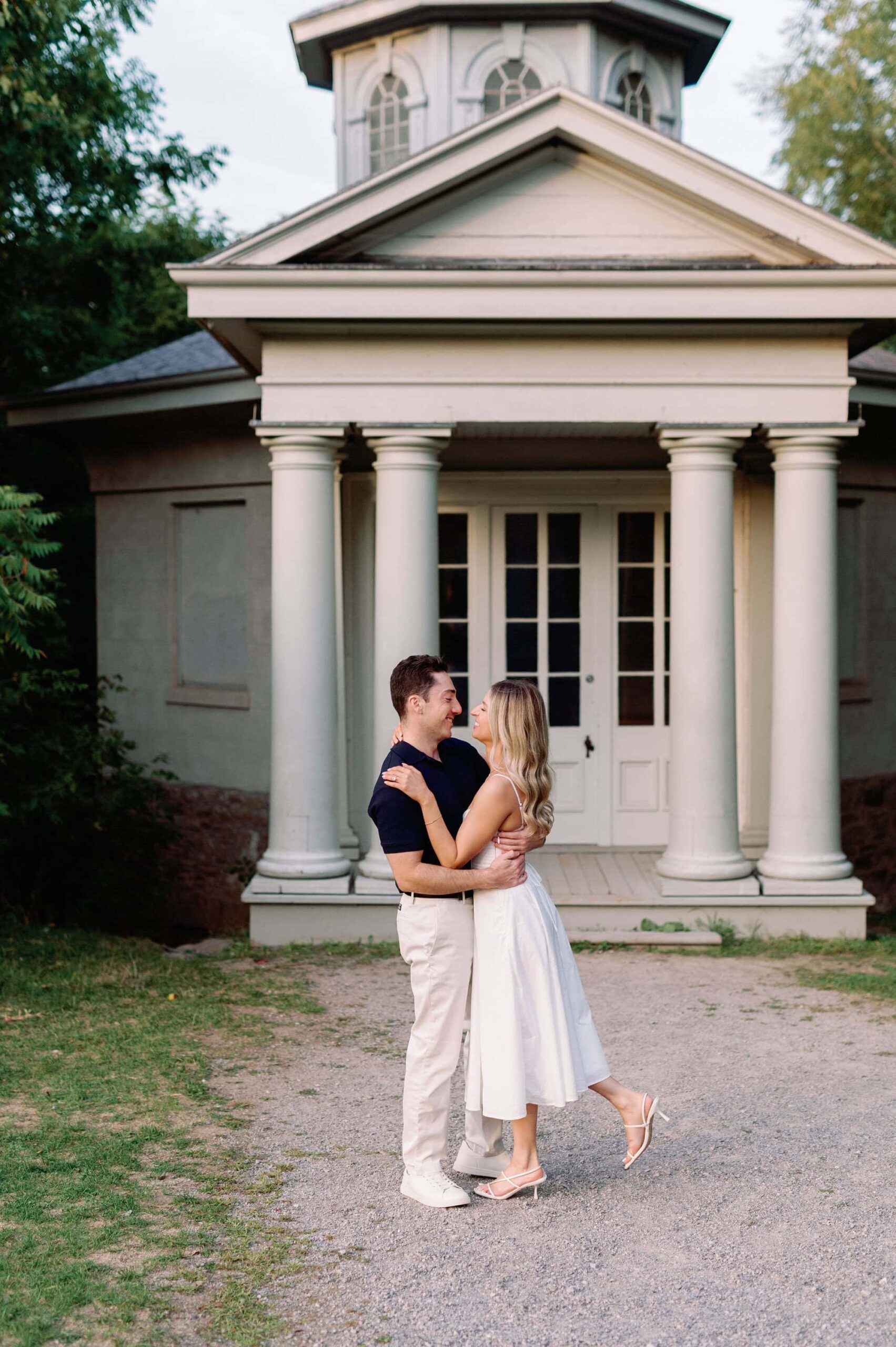 Candid moment with columns and warm evening light at Dundurn Castle