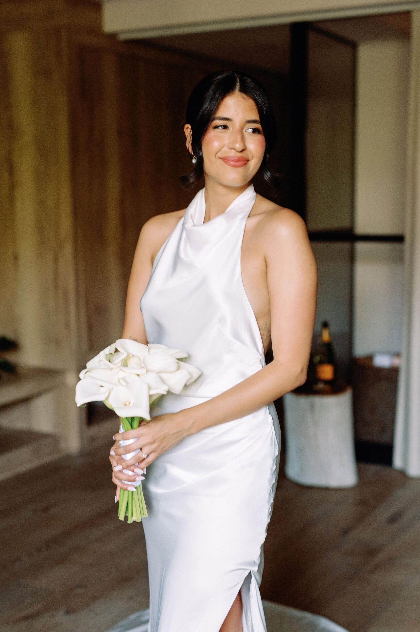 Bride posing with her bouquet in a soft and elegant bridal portrait at 1 Hotel Toronto.