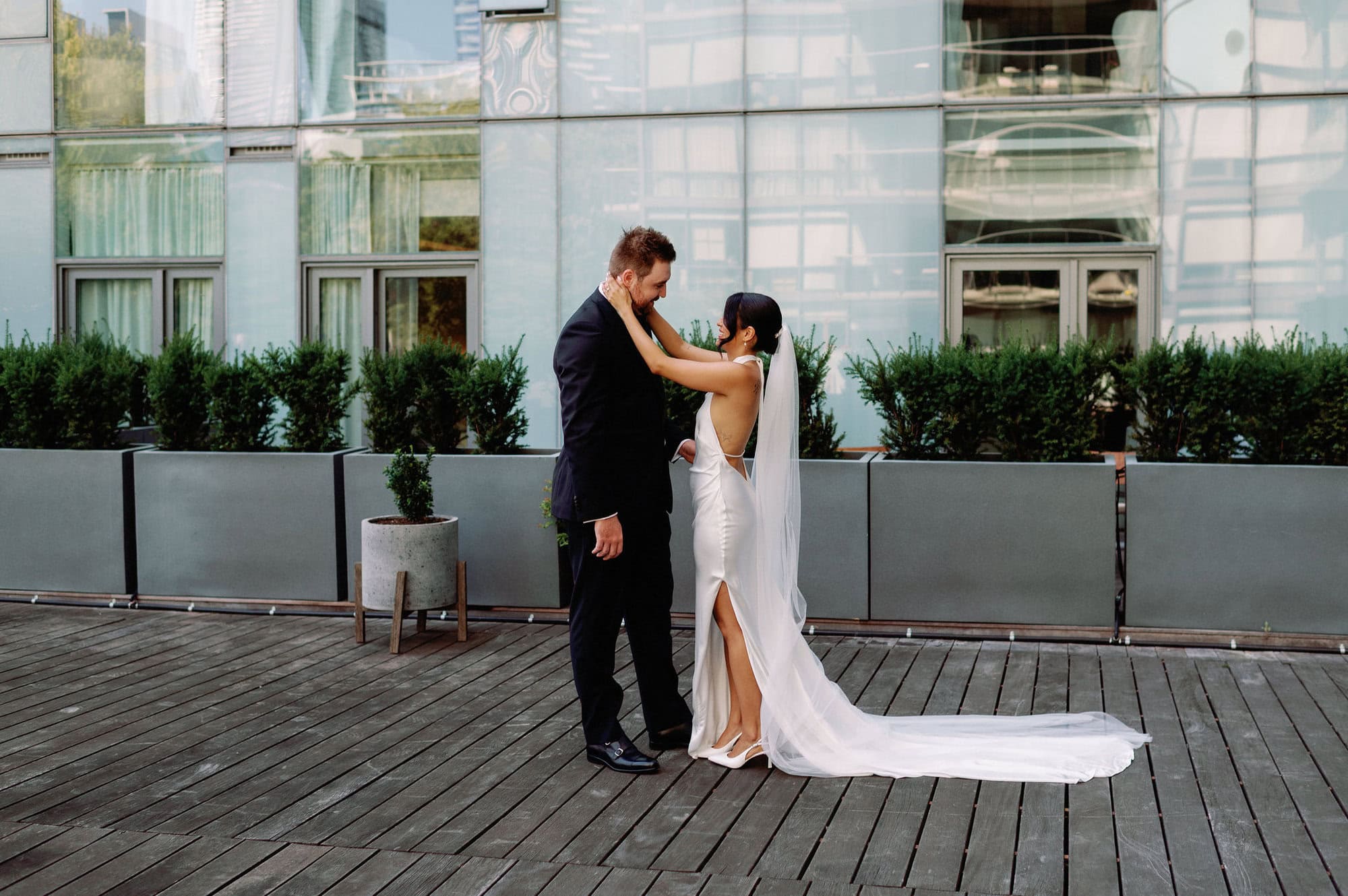 Bride and groom emotional first look on the terrace at 1 Hotel Toronto.