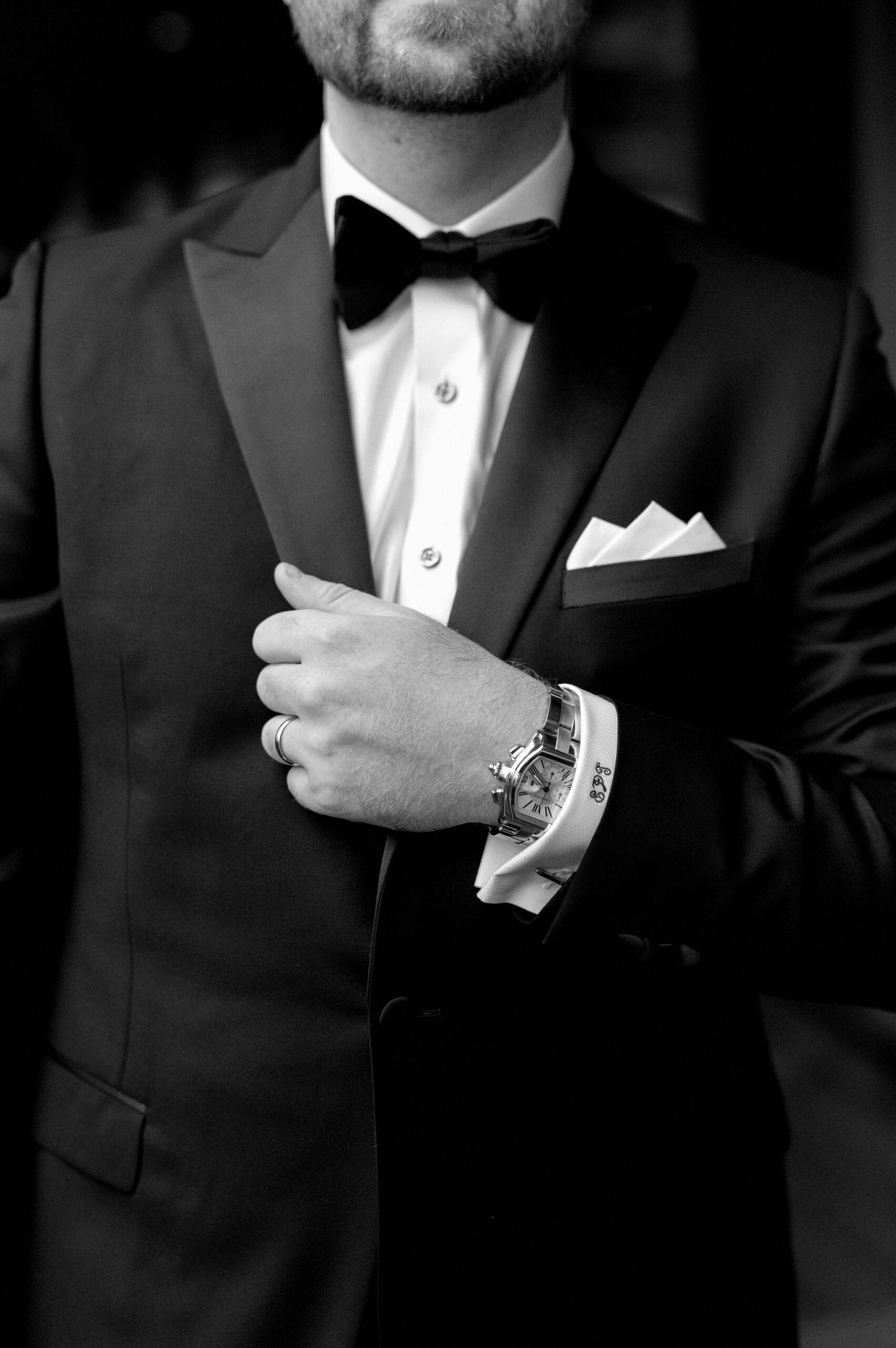 Close up of the groom adjusting his suit jacket before the wedding at 1 Hotel Toronto.