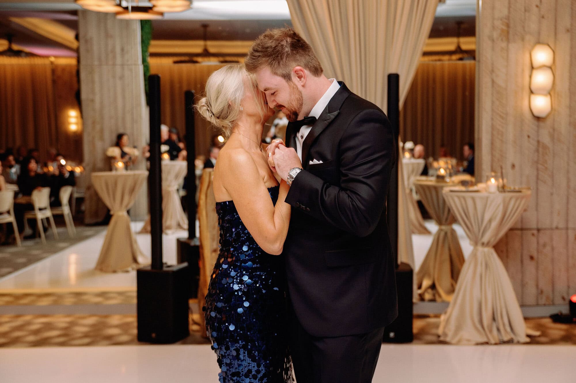 Groom dancing with his mom during an emotional moment on the dance floor at 1 Hotel Toronto.