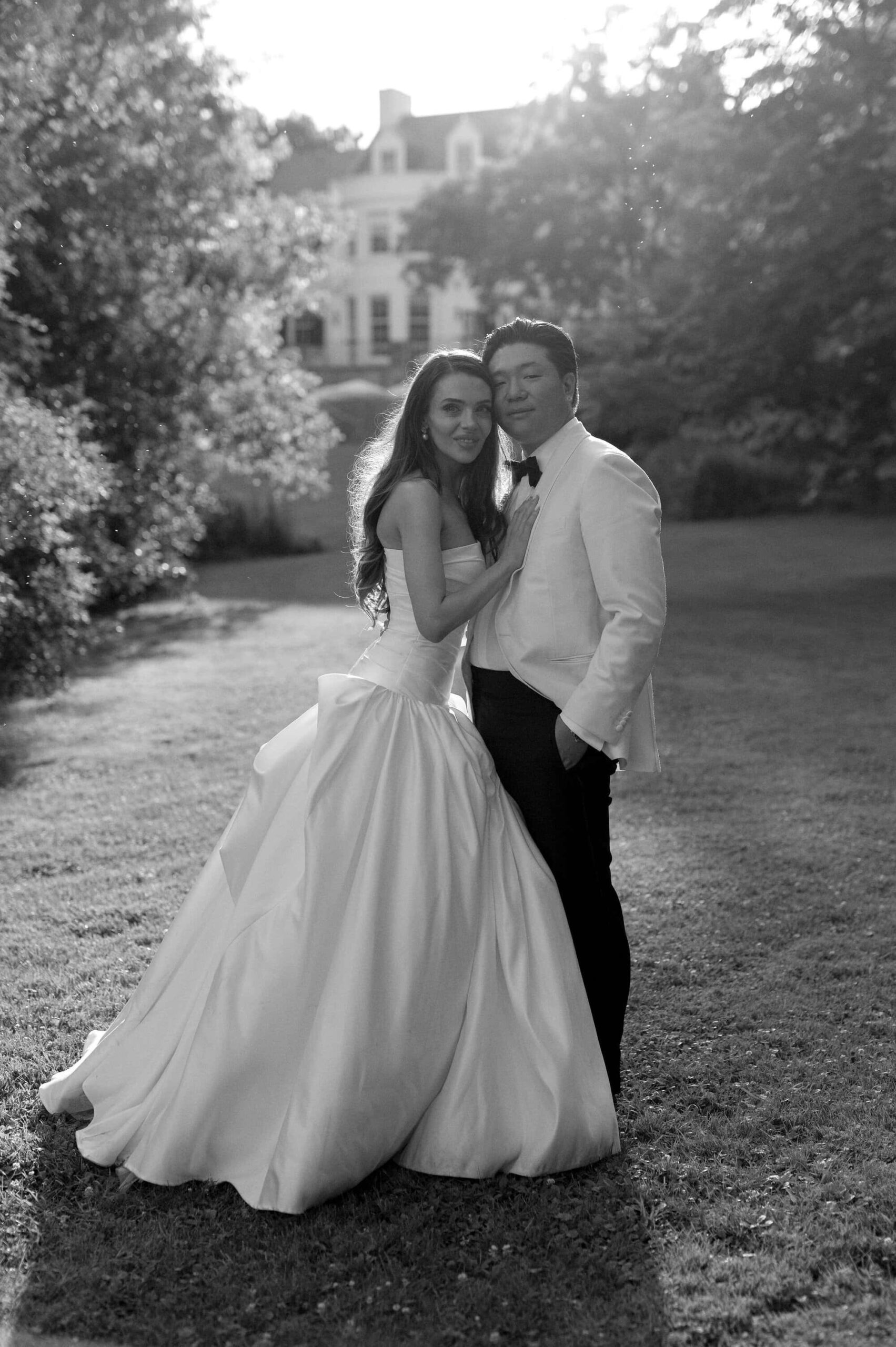 Black and white portrait of the bride and groom standing together at Harding Waterfront Estate.